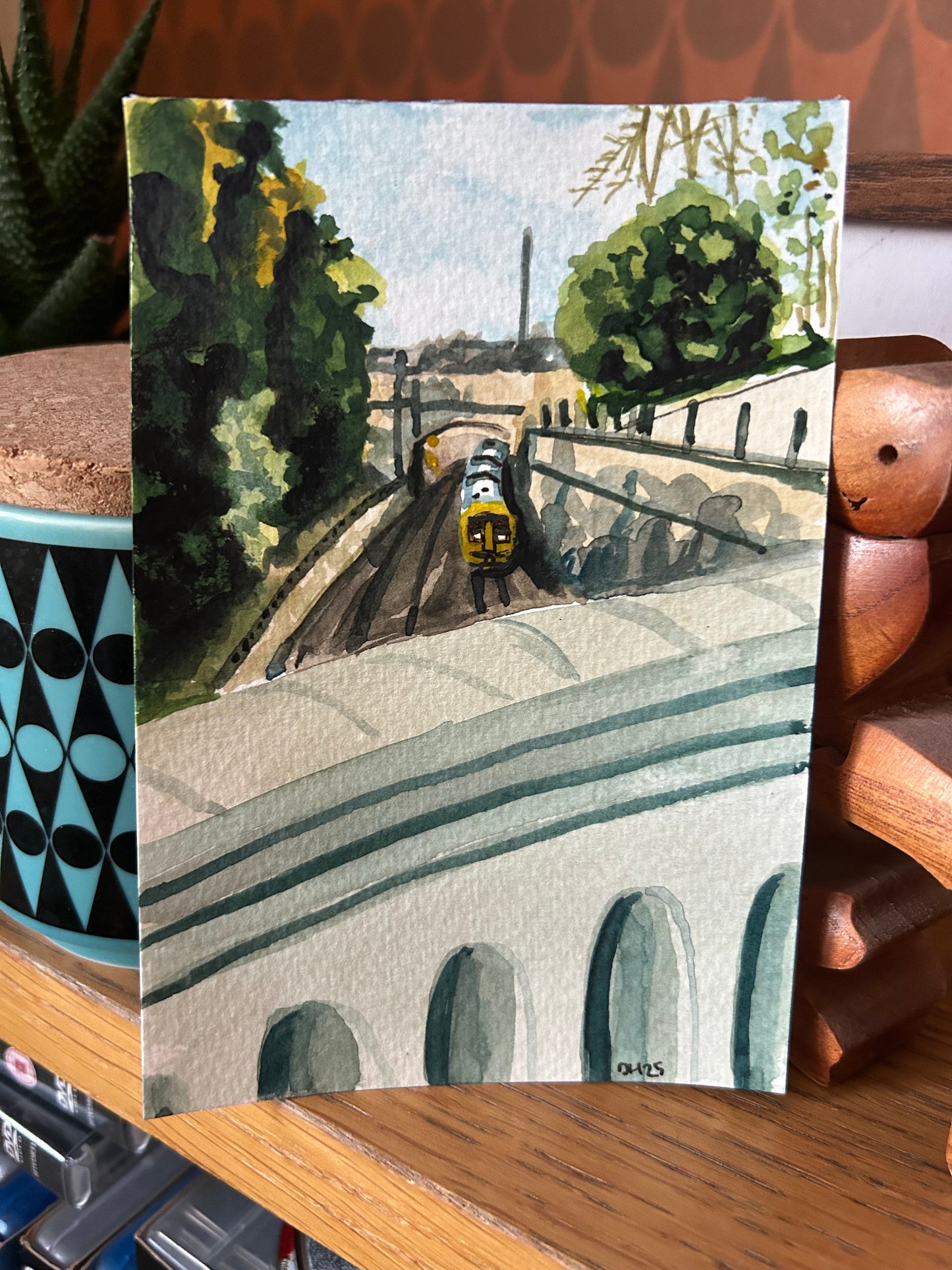 Watercolour postcard of train coming into Bath