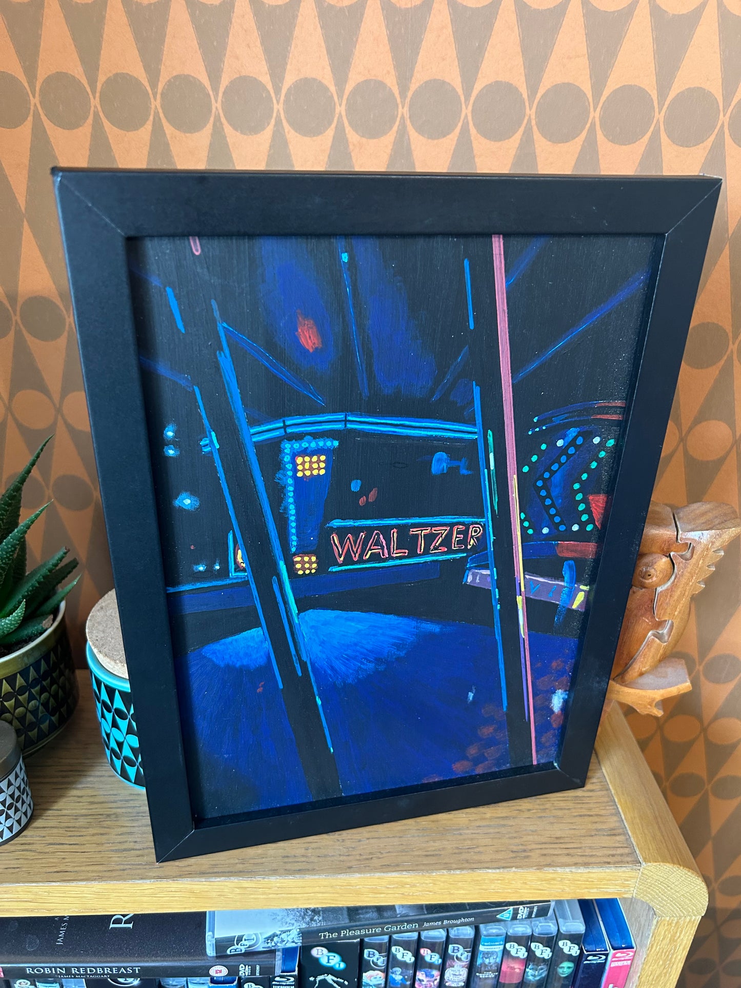 ‘The heavens opened. We couldn’t go back.’ A4 night painting. Acrylic on board. Framed. Fun Fair 2024 34