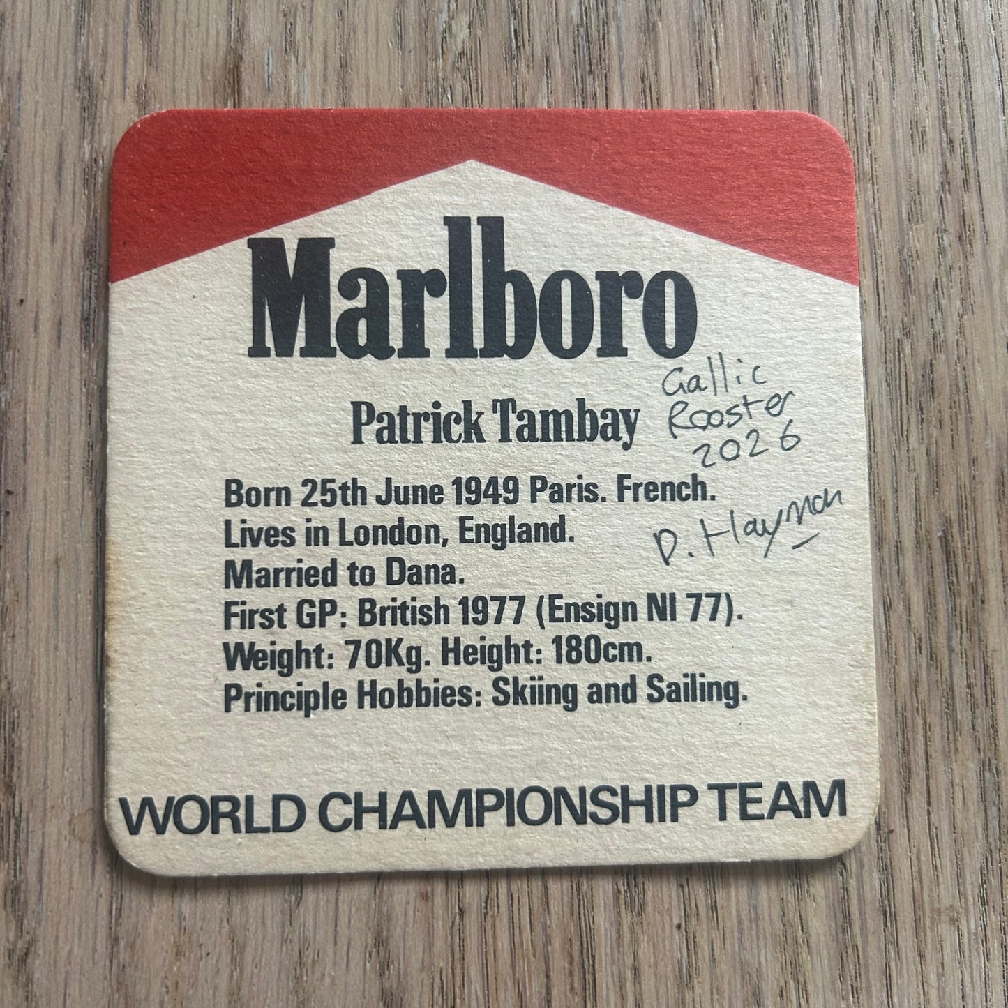 A Gallic Rooster painted onto a Patrick Tambay Malboro World Championship Team beer mat from the 1970s. Beermat painting. Watercolour.