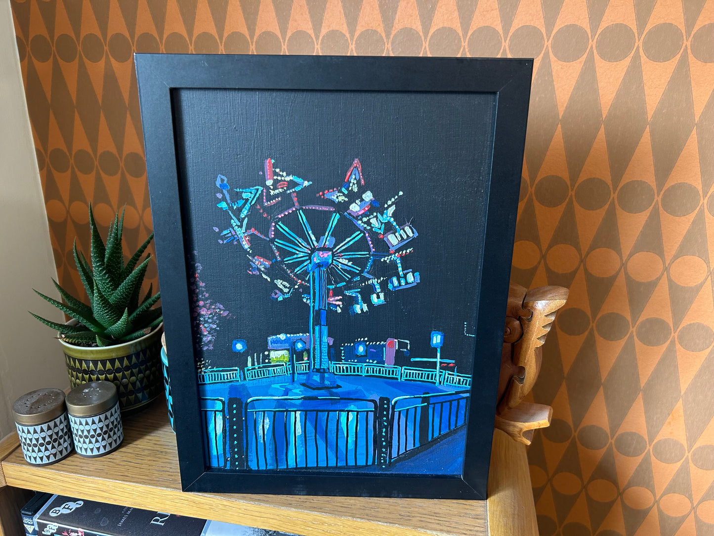 ‘I don’t need it every night. Just occasionally. Like now’ A4 night painting. Acrylic on board. Framed. Fun Fair 2024 09