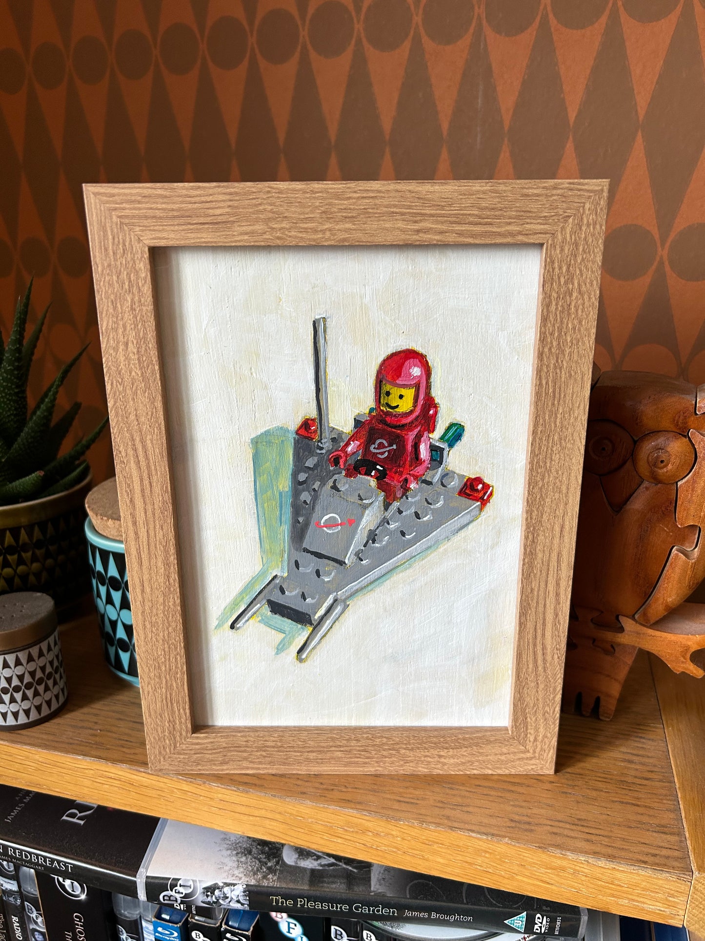 ‘I Will Chase You’. Lego 1980 set 885. A5 painting. Acrylic on board. Framed. 2025