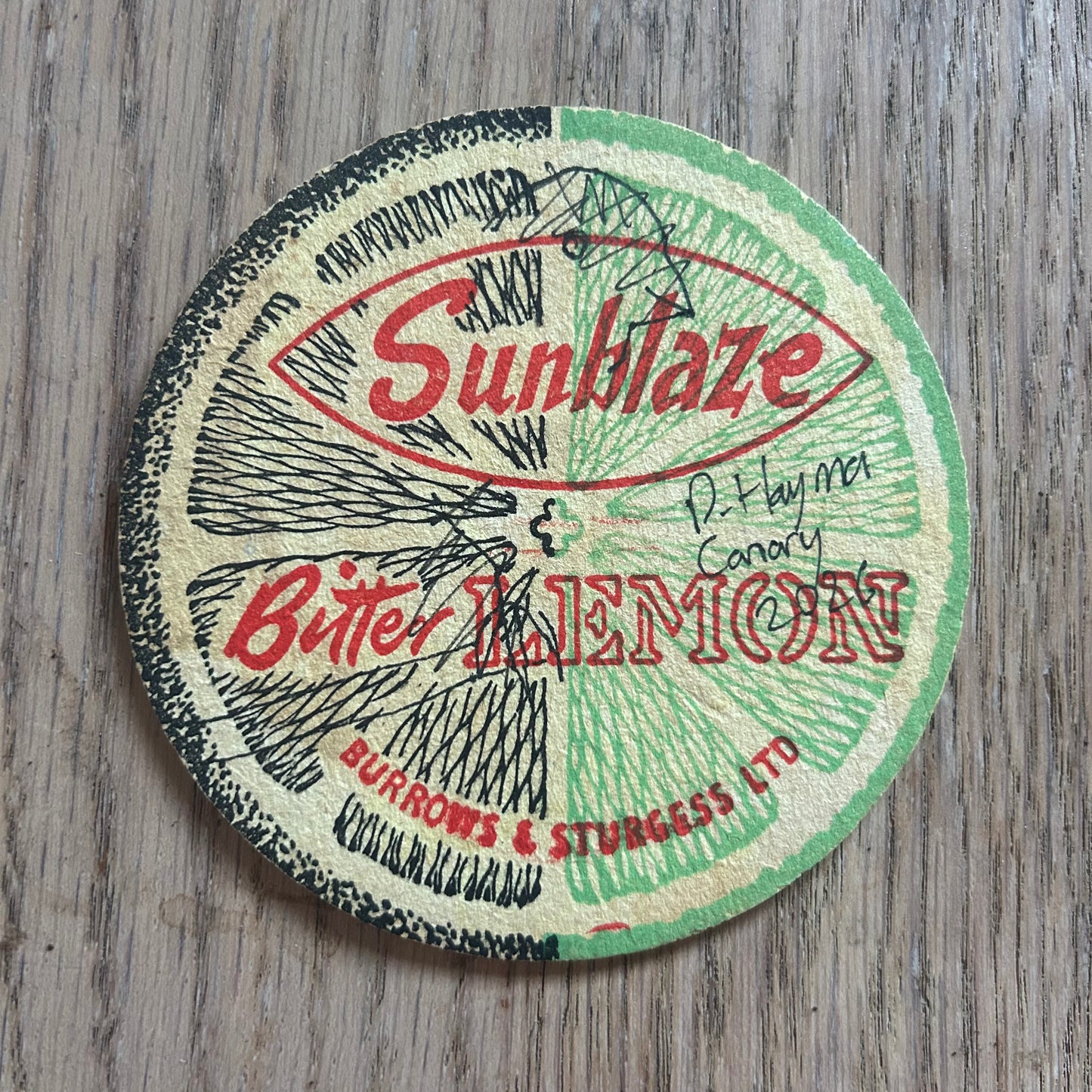 A Canary painted onto a Sunblaze Bitter Lemon drinks mat from the 1950s. Beermat painting. Watercolour.