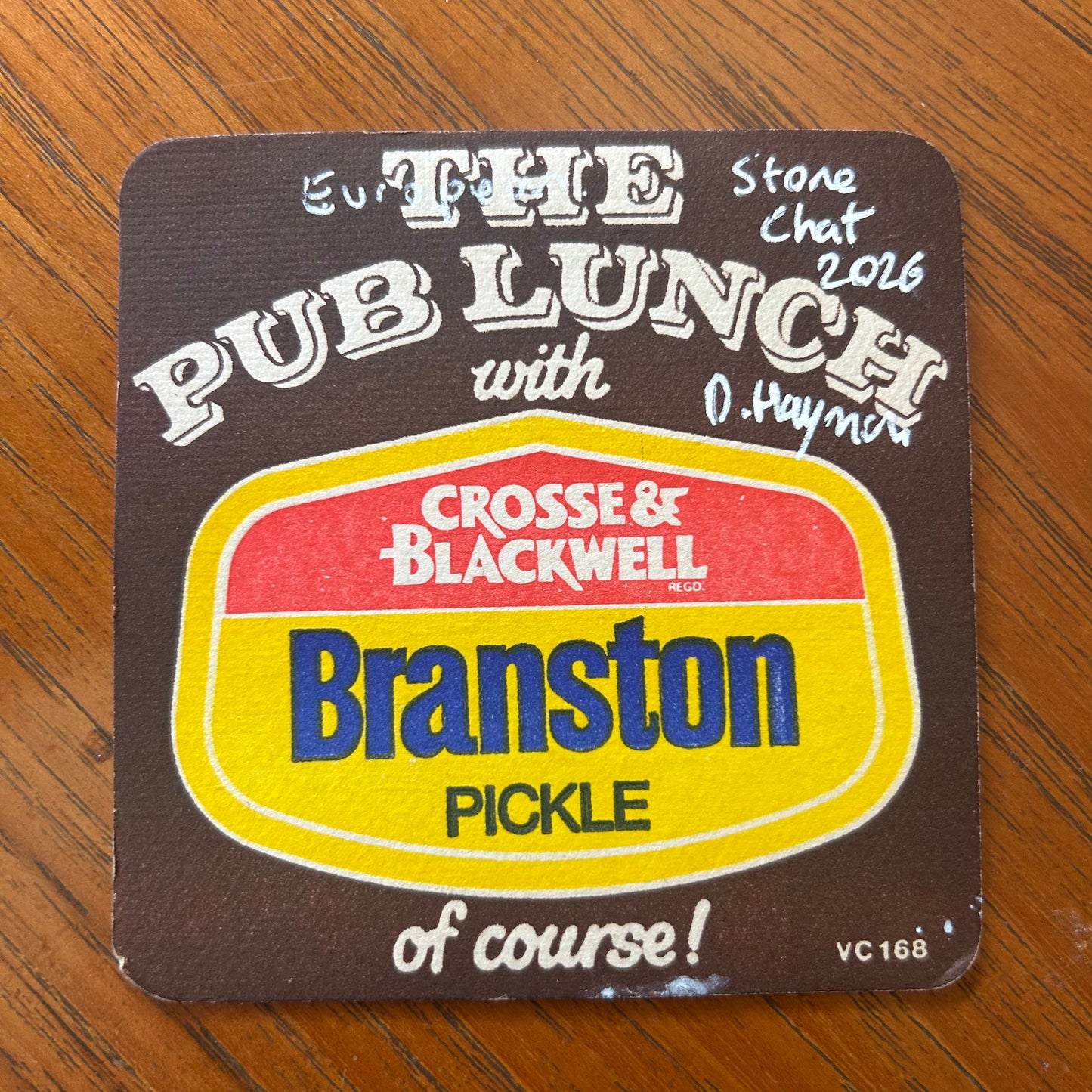 An Eurasian Stone Chat painted onto a Branston Pickle Beermat painting. Watercolour.