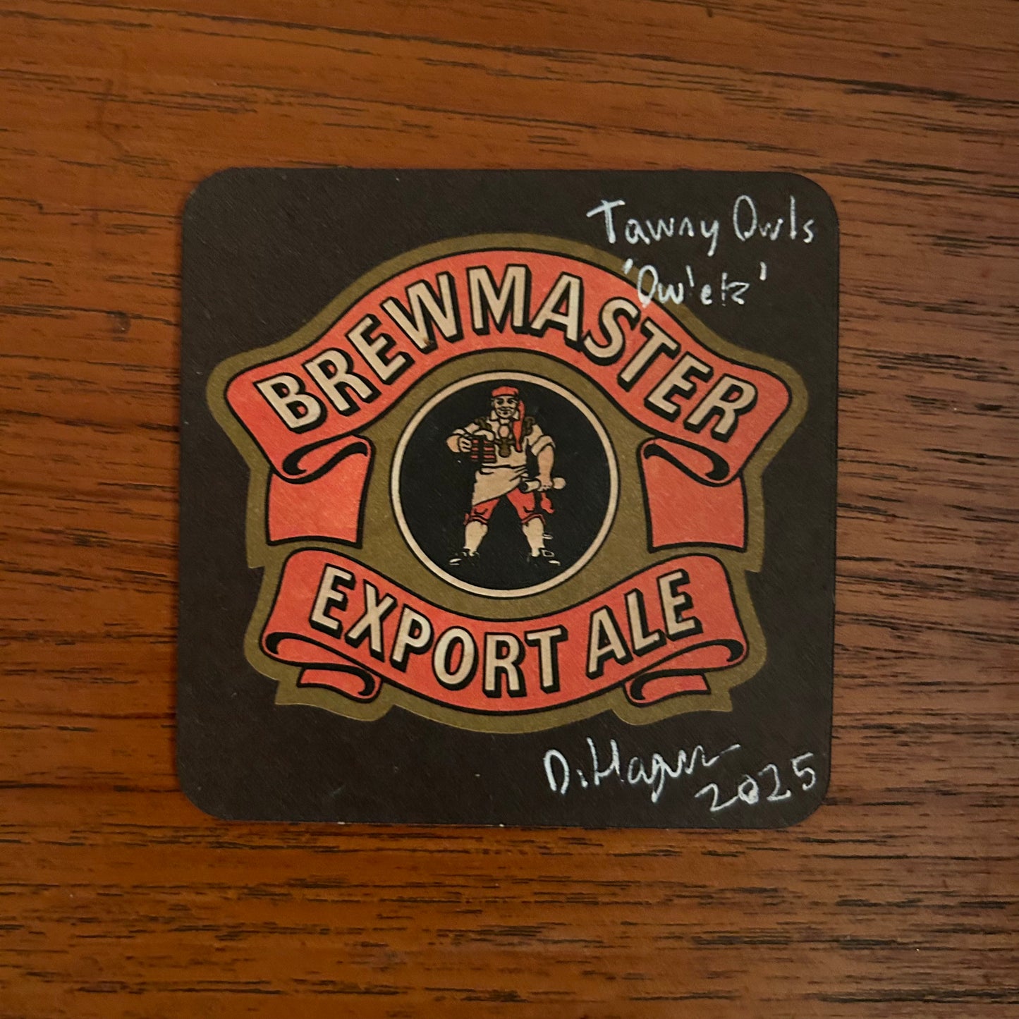 Two Tawny Owlets painted onto a drink/drive Brewmaster Export Ale beer mat from the 1970s. Beermat painting. Watercolour.