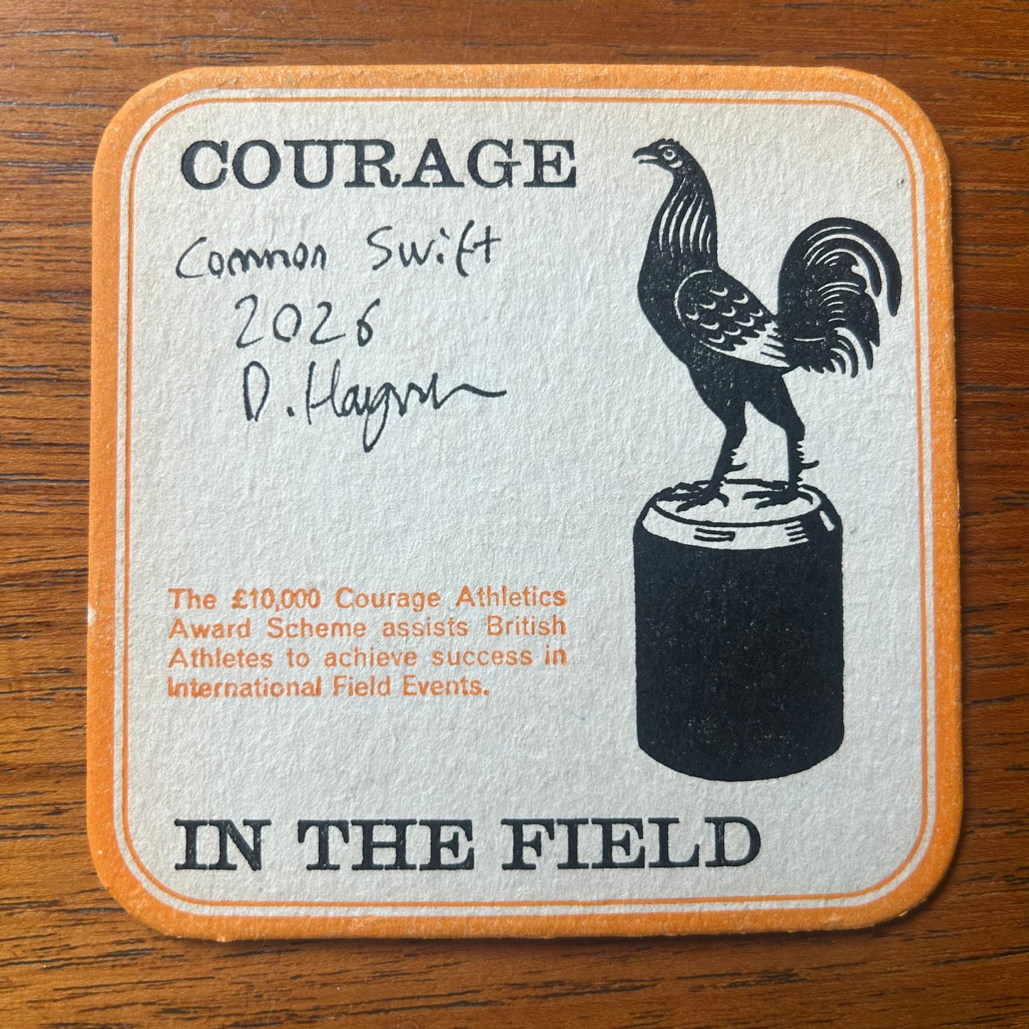A Common Swift painted onto a Courage Beer ‘In The Field’ athletics beer mat from 1964. Beermat painting. Watercolour.