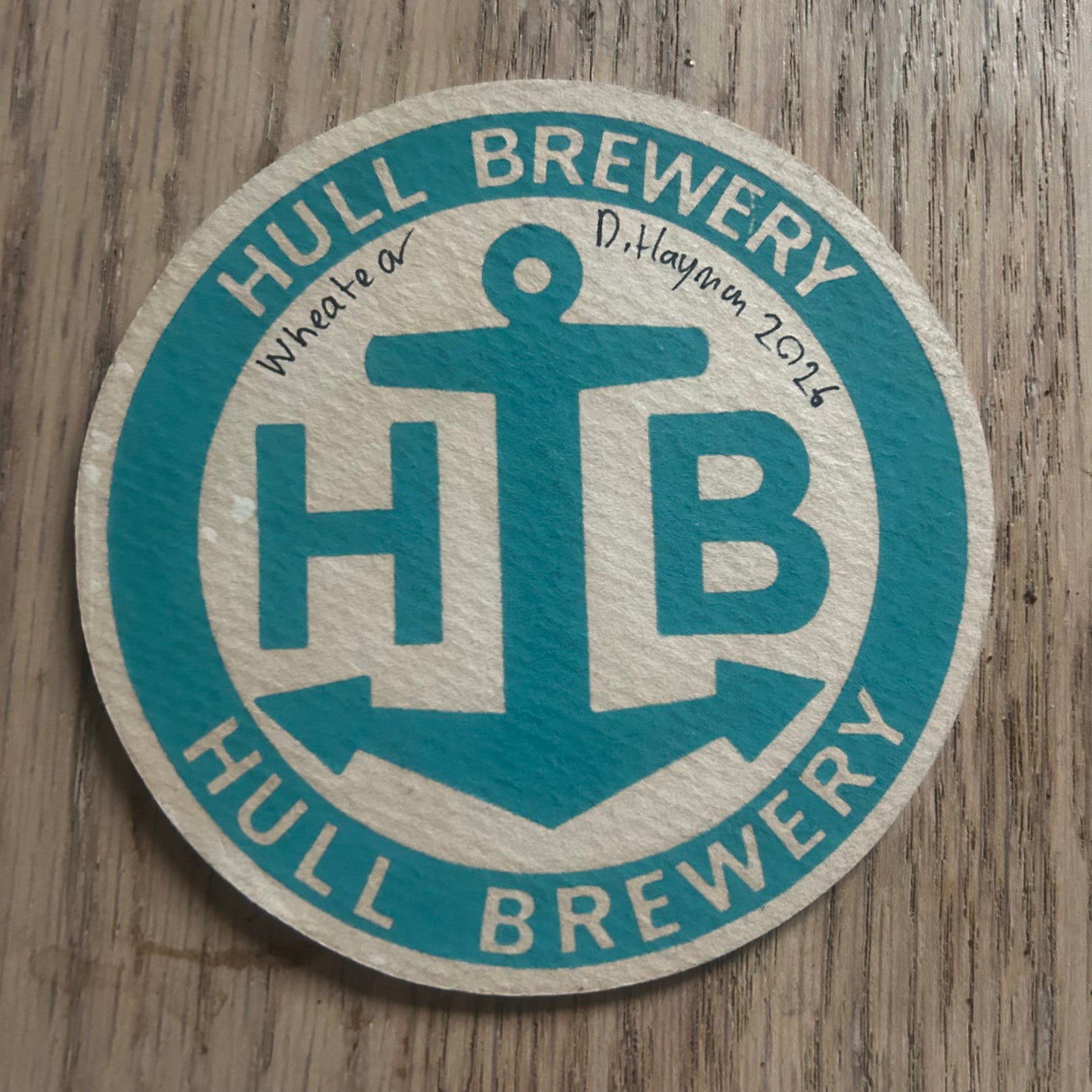 A Wheatear painted onto a Hull Brewery beer mat from 1970. Beermat painting. Watercolour.