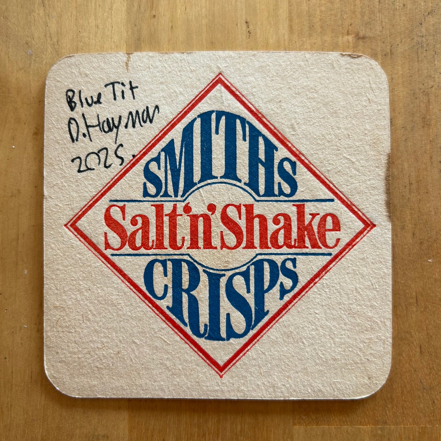 A Blue Tit painted onto a Salt’n’Shake beermat. Beermat painting. Watercolour.