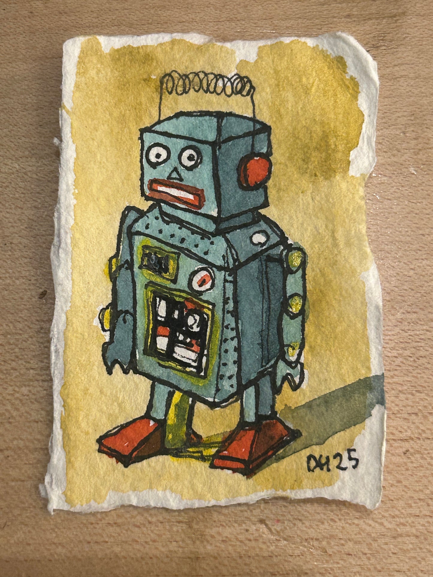 Tiny cotton rag paper water colour painting of a toy robot 3/7 approx 5.5 cm x 8 cm.