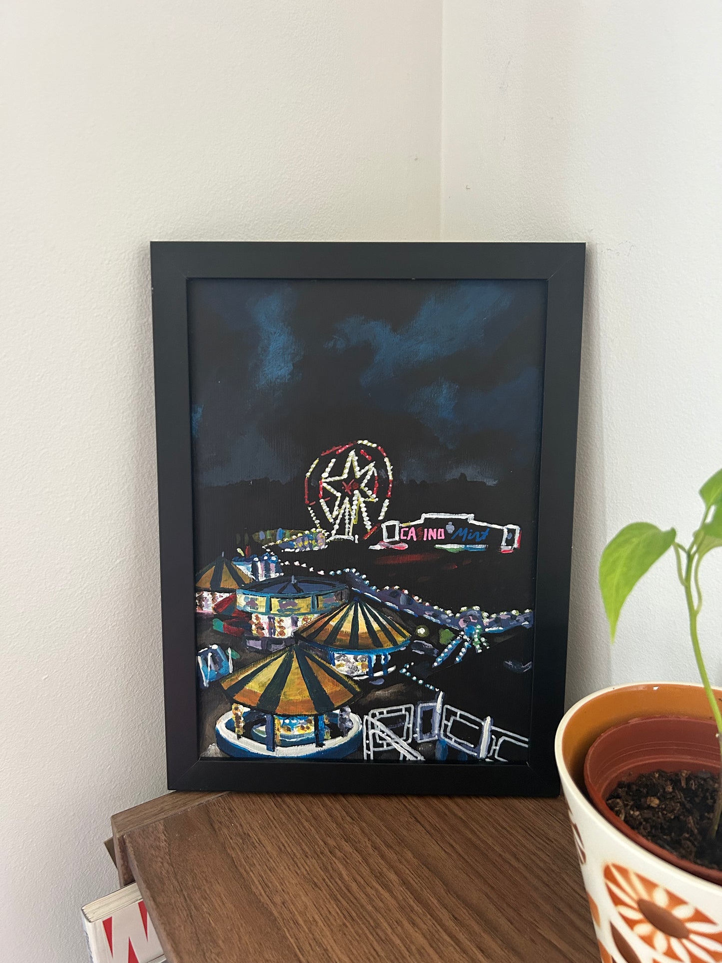 ‘I miss you, though it may look like I don’t.’ A4 night painting. Acrylic on board. Framed. Fun Fair 2024 05