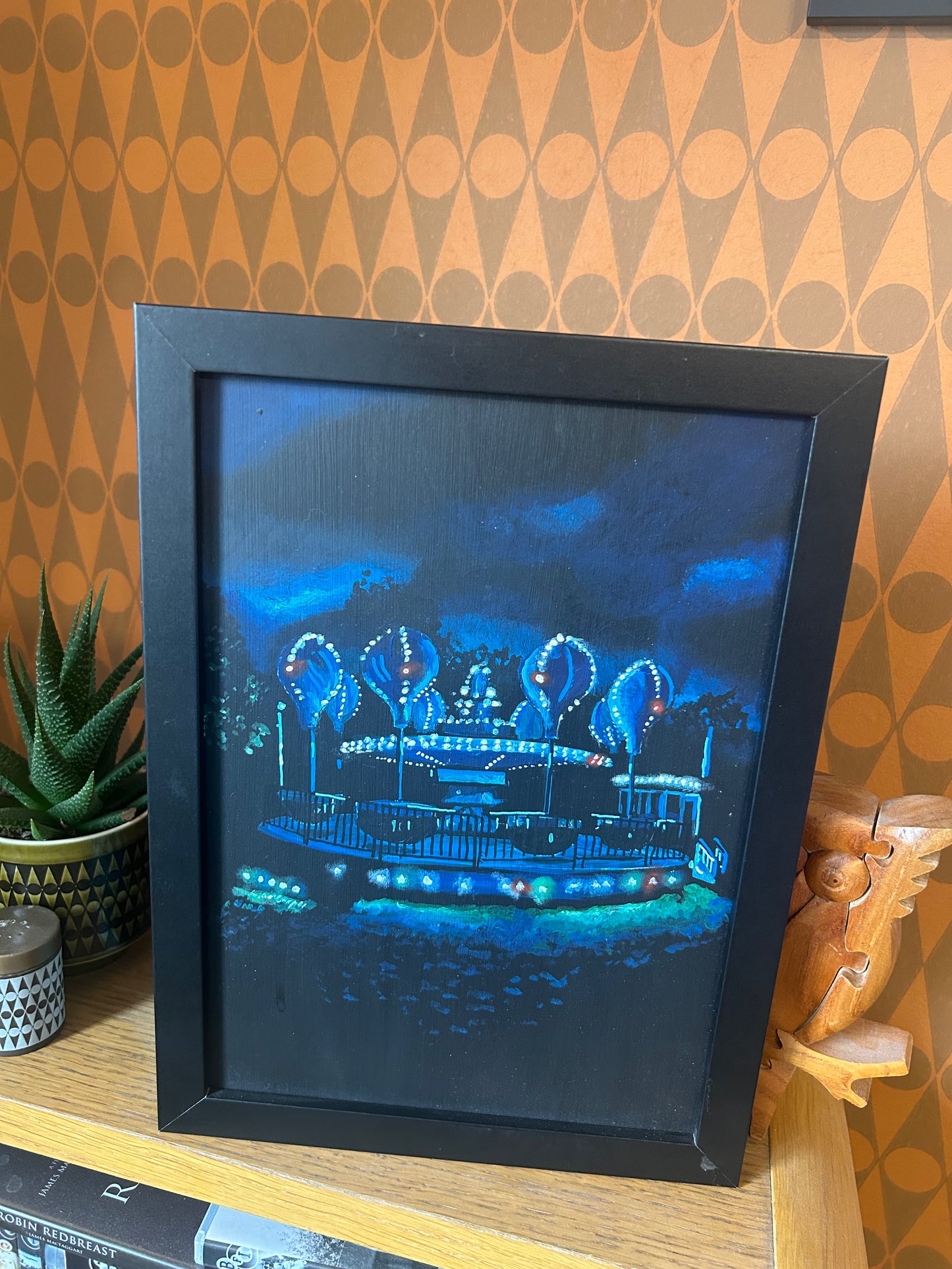 ‘I wish you’d told me. Maybe I could have made a difference.’ A4 night painting. Acrylic on board. Framed. Fun Fair 2024 31