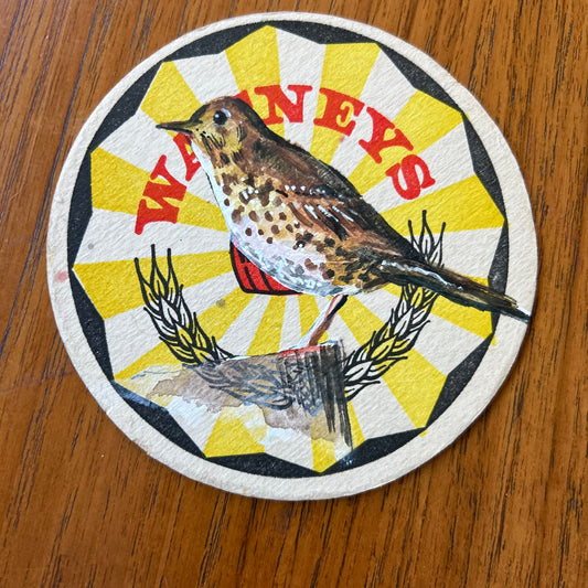 A Thrush painted onto a ‘’Watneys” Beer Mat from the 1960s. Beer mat painting. watercolour and acrylic on card.