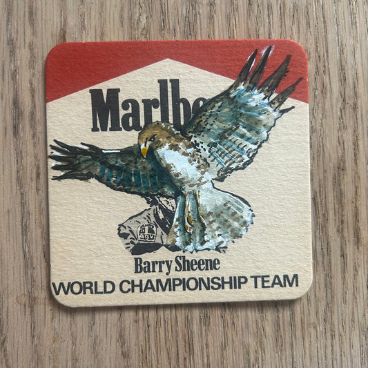 A Red Tailed Hawk painted onto a Barry Sheene Malboro World Championship Team beer mat from the 1970s. Beermat painting. Watercolour.