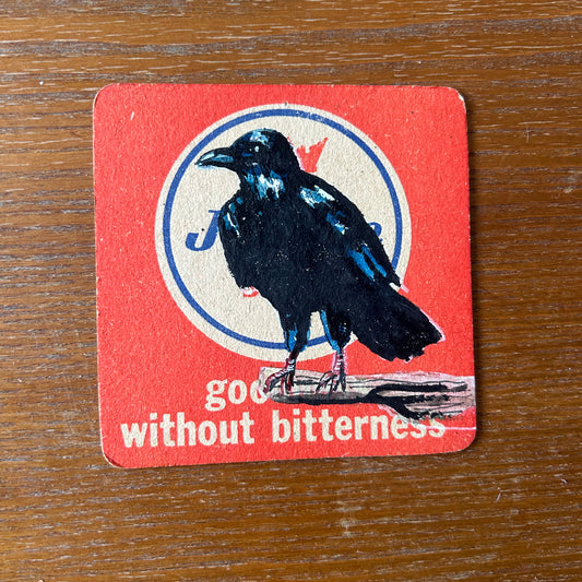 A Raven painted onto a Jubilee Stout beer mat from the 1960s. Beermat painting. Watercolour.