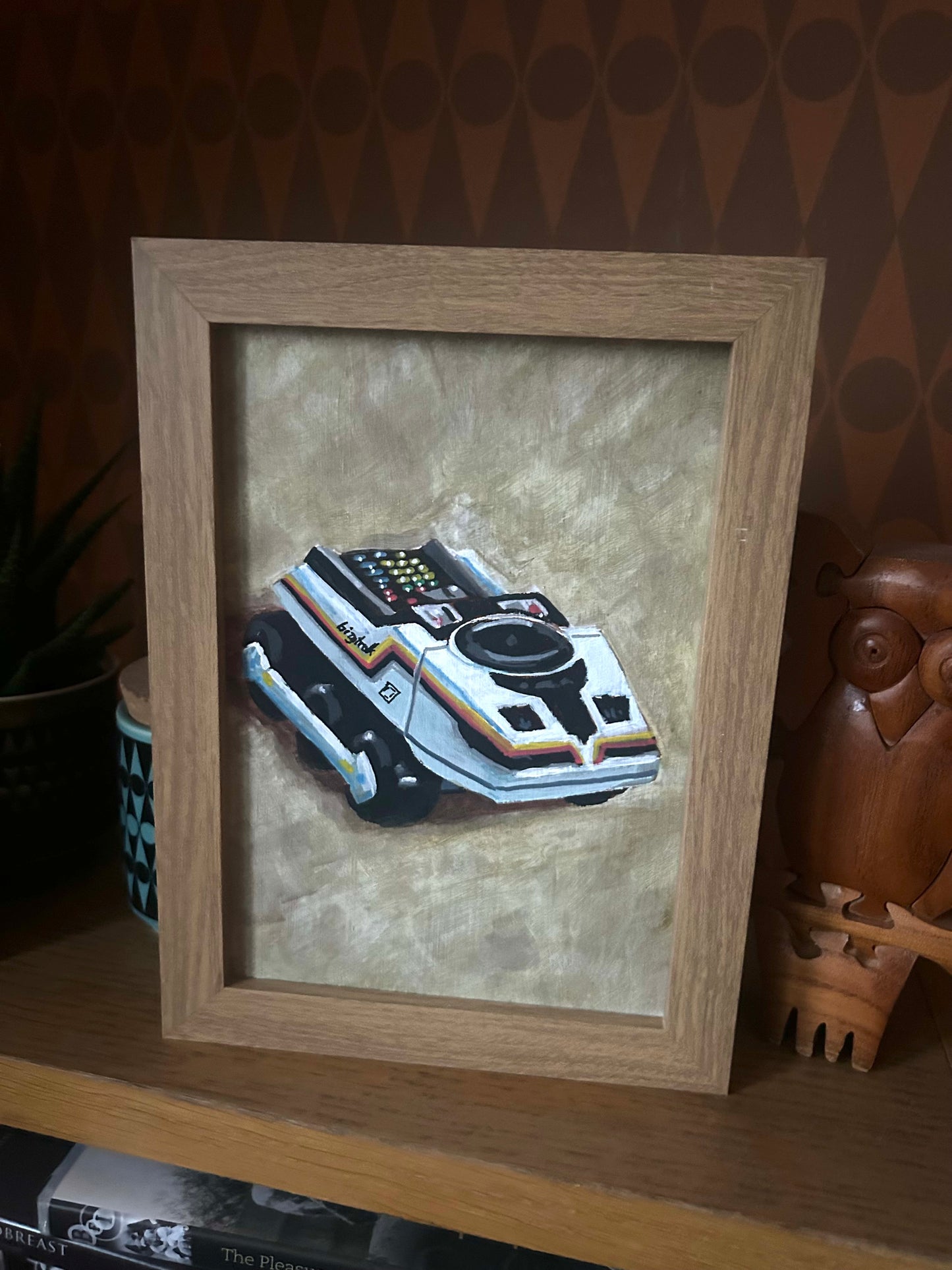 ‘Don’t Pretend’. Painting of Big Trak toy. Acrylic on board. Framed. 2025.