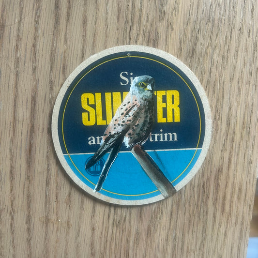 Kestrel painted onto a Slimster drinks mat from the 1960s. Beermat painting. Watercolour.