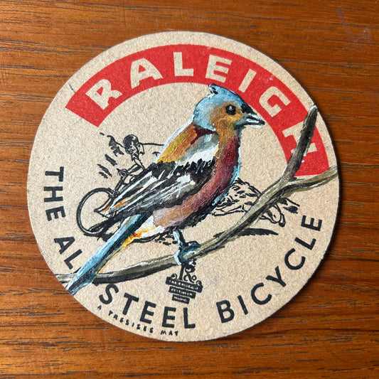 A Chaffinch painted onto a ‘’Raleigh - The All Steel Bicycle” 1950s beer mat. Beer mat painting. watercolour and acrylic on card.