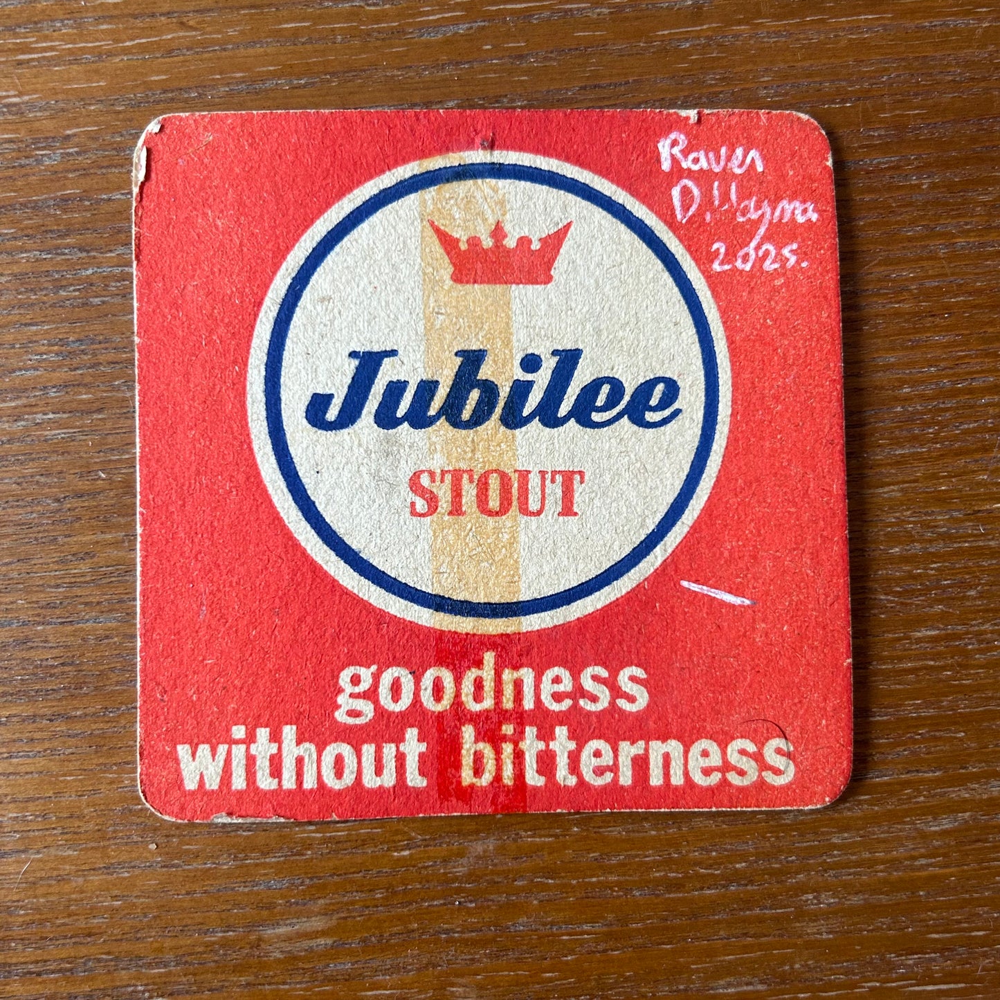 A Raven painted onto a Jubilee Stout beer mat from the 1960s. Beermat painting. Watercolour.