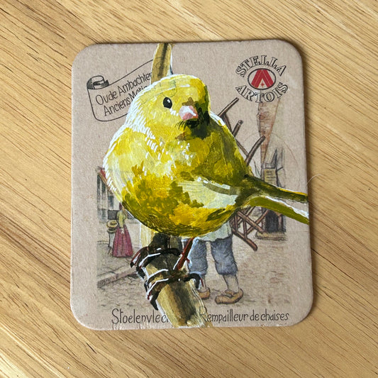 A Canary painted onto a Stella Artois beer mat. Beer mat painting. Watercolour.