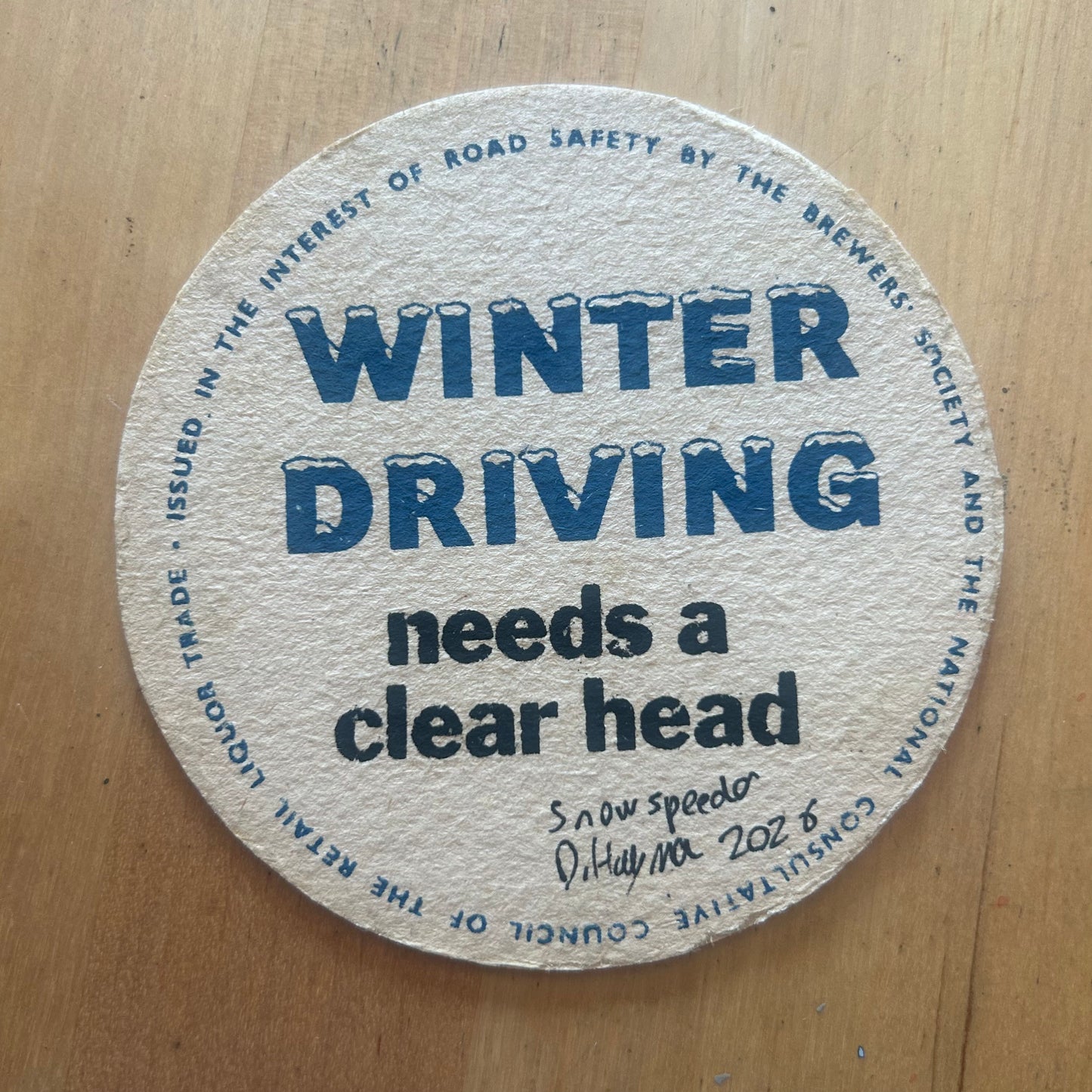 A Snowspeeder painted on a ‘Winter Driving’ Beermat from the 1950s. Beermat painting. Watercolour.