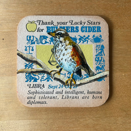 A Redwing painted onto a 1970s Bulmer’s Cider Zodiac drinks mat (Libra). Beermat painting. Watercolour.