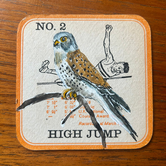 A Kestrel painted onto a Courage Beer ‘In The Field’ athletics beer mat from 1964. Beermat painting. Watercolour.