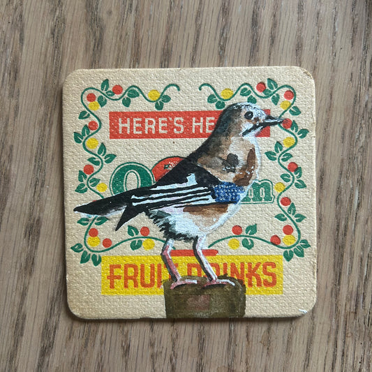 A Jay painted onto a Or-Lem fruit drinks drinks mat from the 1950s. Beermat painting. Watercolour.