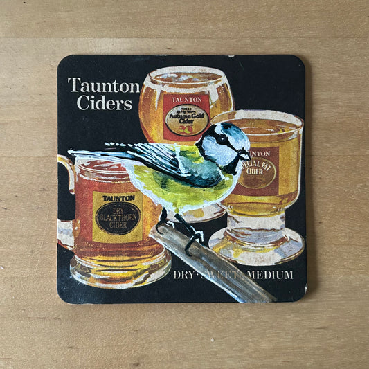 A Blue Tit painted onto a Taunton’s cider drinks mat from the 1970s. Beermat painting. Watercolour.