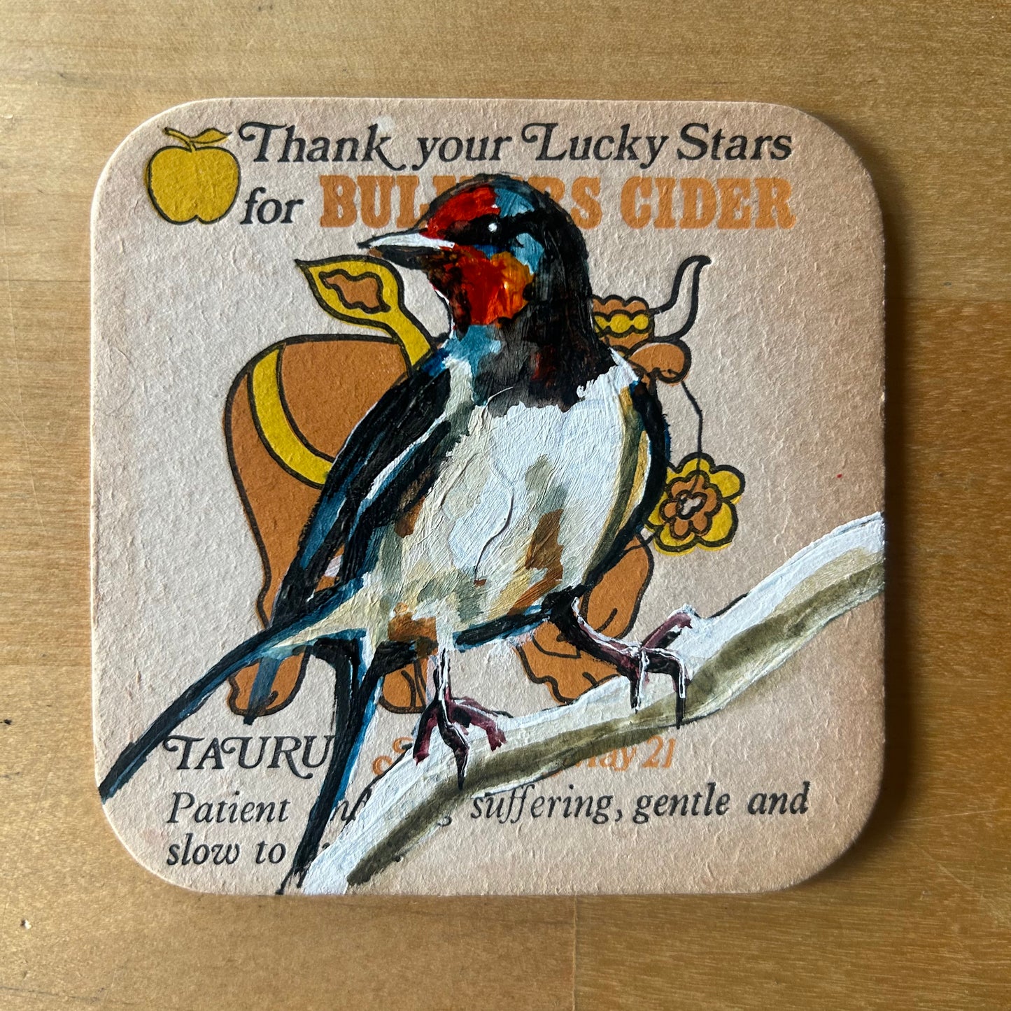 A Barn Swallow painted onto a 1970s Bulmer’s Cider Zodiac drinks mat (Taurus). Beermat painting. Watercolour.