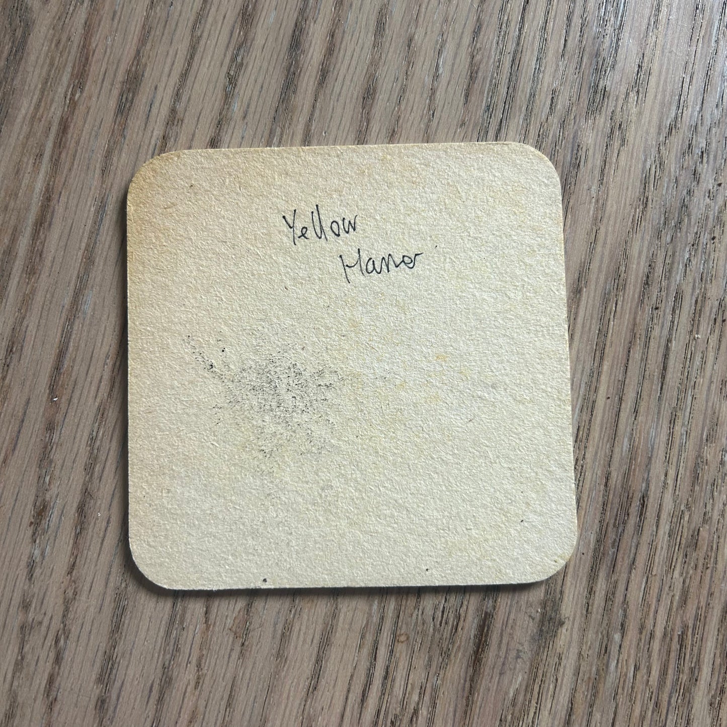 A Yellow Hammer painted onto a Marloboro drinks mat from the 1970s. Beermat painting. Watercolour.