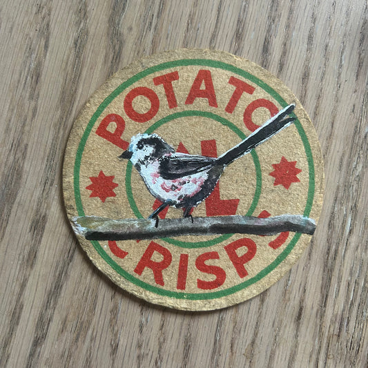 A Longtailed Tit painted onto an XL potato crisps drinks mat from the 1950s. Beermat painting. Watercolour.