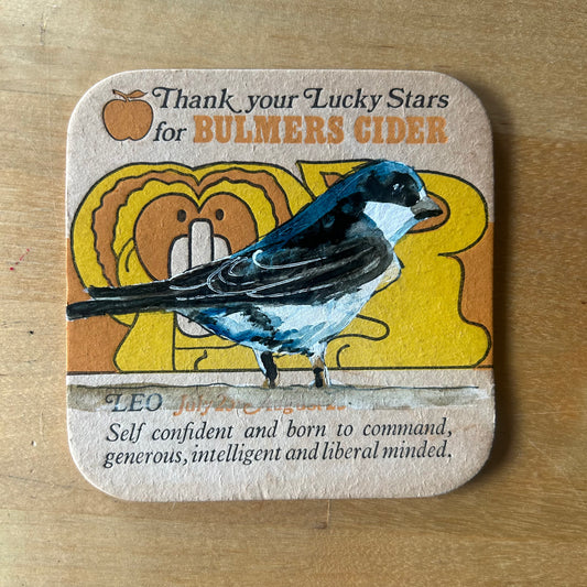 A Housemartin painted onto a 1970s Bulmer’s Cider Zodiac drinks mat (Leo). Beermat painting. Watercolour.