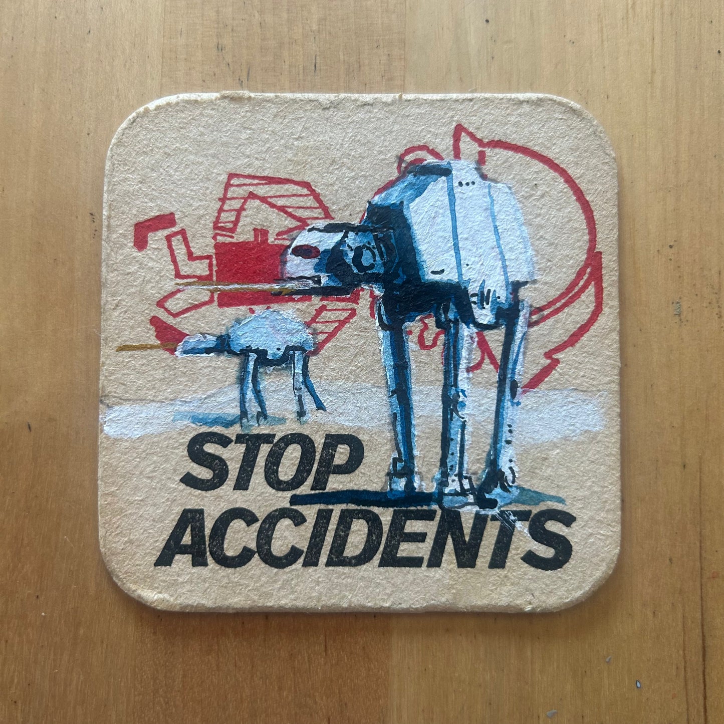 Two AT-ATs painted on a ‘Stop Accidents’ Beermat from the 1950s. Beermat painting. Watercolour.