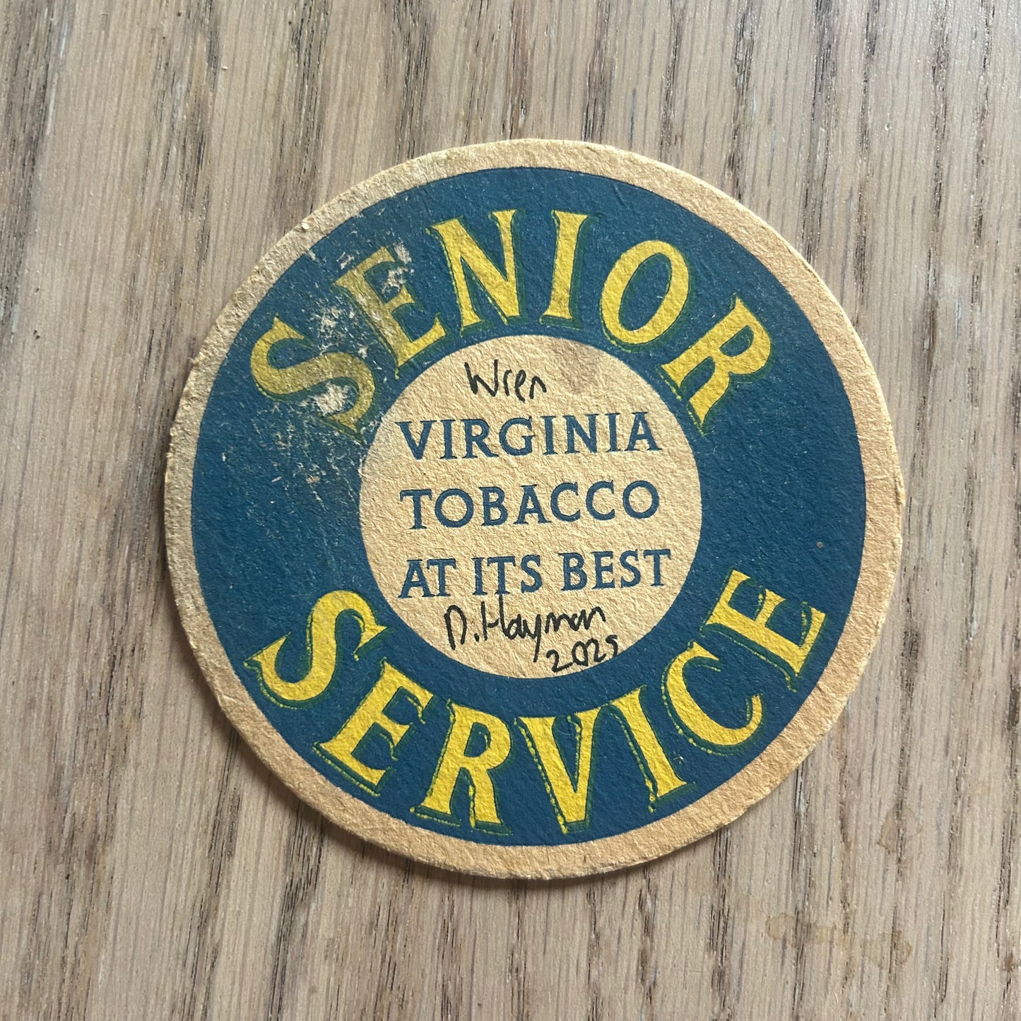 A Wren painted onto a Senior Service tobacco drinks mat from the 1950s. Beermat painting. Watercolour.