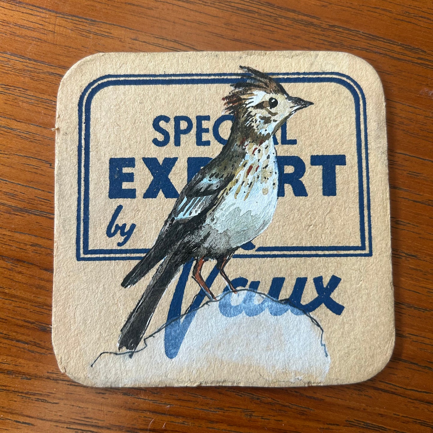 A Skylark painted onto a Special Export by Vaux beer mat from the 1950s. Beermat painting. Watercolour.