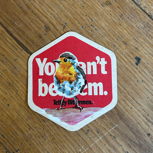 Robin painted onto a Tetley beer mat. Beermat painting. Watercolour.