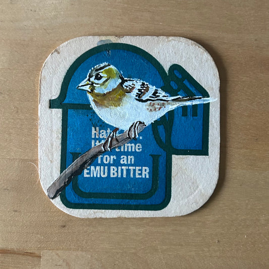 A Brambling painted onto a Emu bitter beer mat from the 1970s. Beermat painting. Watercolour.