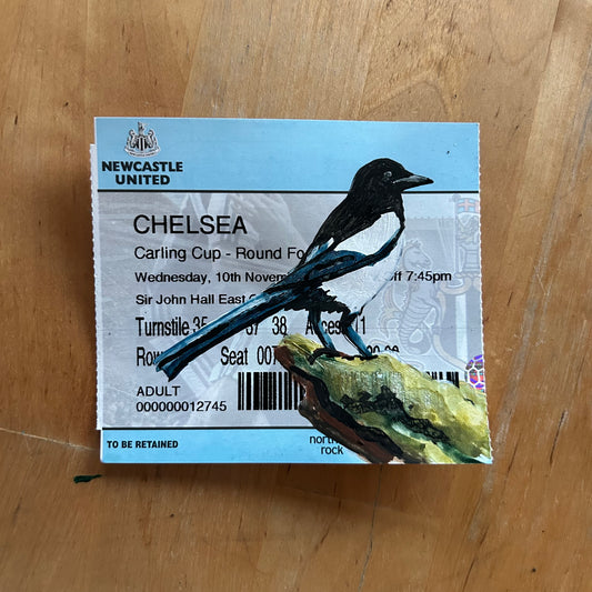 A magpie painted onto a football ticket Newcastle United  vs Chelsea Carling Cup Round Four 2004. Watercolour.