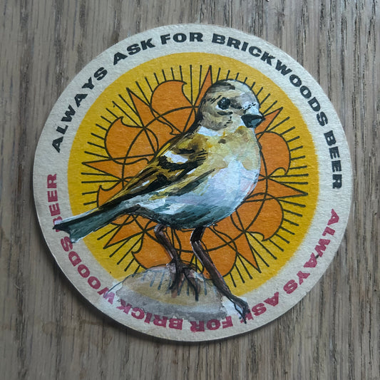 A Brambling painted onto a Brickwoods beer mat from 1969. Beermat painting. Watercolour.