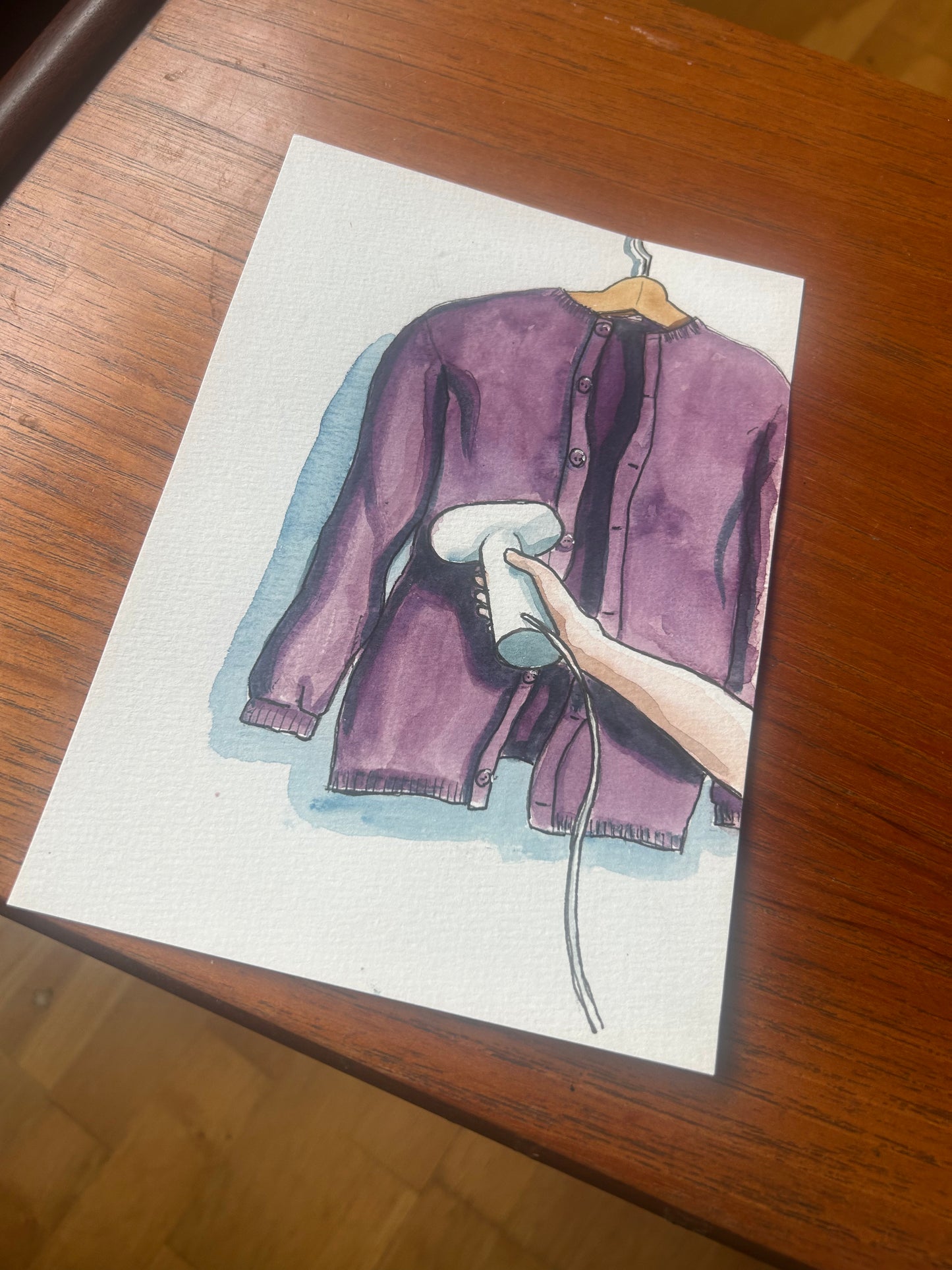 ‘Cardigan Steaming’ illustration A-8 Original painting for the book ‘Knit Repair’ by Alexandra Brinck, published by Quadrille/Penguin. Watercolour on paper A5.