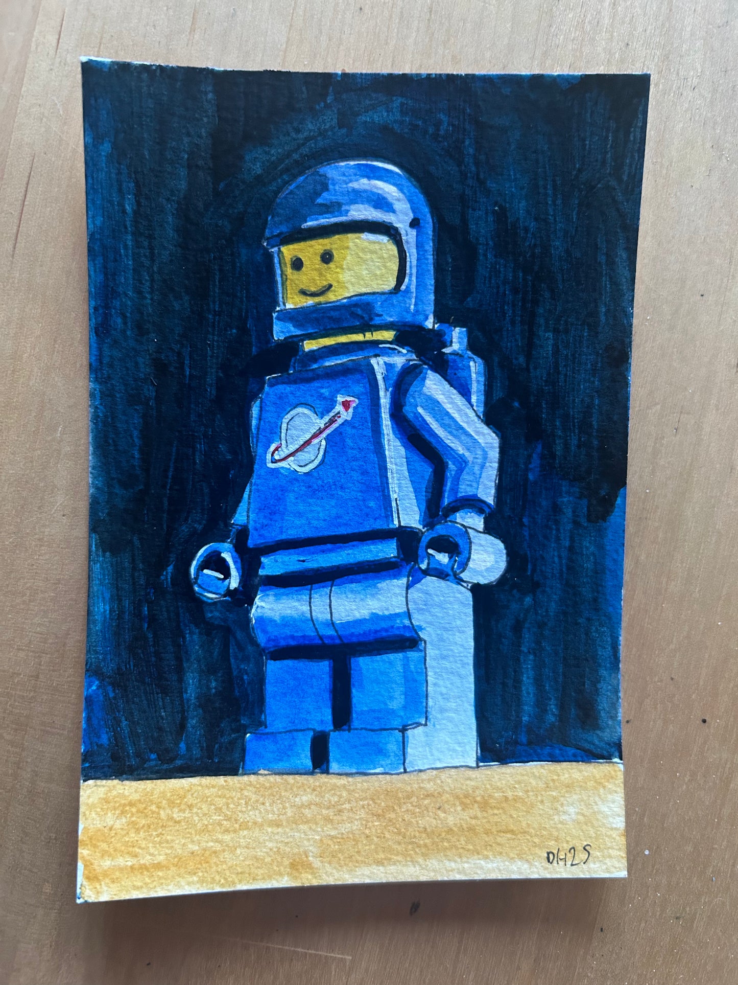 ‘Believe in Future’ Postcard painting of a Lego Spaceman figure 1978.