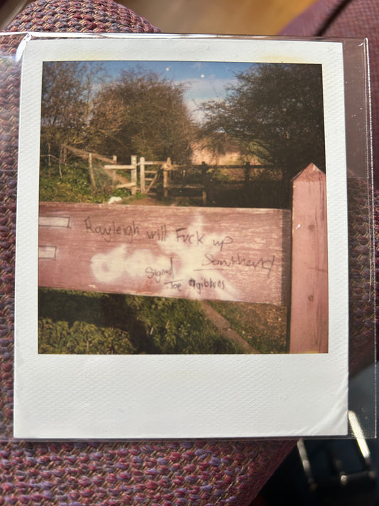 Polaroid photo 004. A Polaroid photo by Darren used as part of the artwork for his album ‘Essex Arms’. Features a lyric that Darren used on the album. Darren will sign the back of the photograph